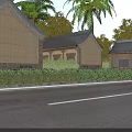 Traditional Ancient Buildings With Gray Tiled Roofs Earth Yellow Walls And Palm Trees By Road