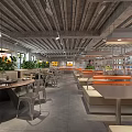 Industrial Style Restaurant Interior With Open Layout Green Plants Metal Tables And Orange Seats