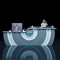 Modern Futuristic Reception Desk Featuring Circular Blue Lighting And Staff At Work