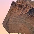 Scenic Garden Landscape With Red Mountain Ranges And Small Town At Foot