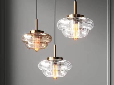 Three Modern Glass Pendant Lights with Brass Accents and Clear Shades 3d model