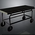 Vintage Metal Frame Furniture Cart With Black Top Surface And Rolling Wheels