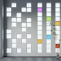 Decorative Wall With Multiple Square Panels White And Colorful Squares And Green Plant