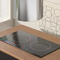 Sleek Modern Kitchen Induction Cooktop On Wooden Counter With Geometric Wall Art