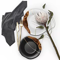 Elegant Tableware Set With Gold Cutlery Gray Napkin White Black Plates And Protea Flower