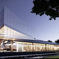 Modern Sales Office Building Design With Green Landscaping And Exterior Lighting Effects