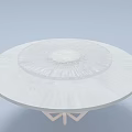 Round White Dining Table With Textured Top And Geometric Base Design
