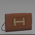 Brown Leather Clutch With Gold H Logo And Elegant Smooth Design