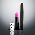 Stylish Cosmetics Display Pink Lipstick Black Mascara With Polka Dot Case On Sleek Reflective Surface