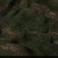 Aerial Planning View of Winding River Through Green Mountains Forest and Villages