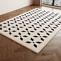 Square Rug with Black Geometric Patterns Beige Background on Herringbone Wooden Floor and Fringe Detail