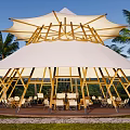 White Round Tent With Wooden Platform Surrounded by Palm Trees Outdoor Seating Area