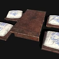 Wooden Dining Table With Four Cushions Featuring Blue And White Floral Patterns