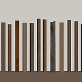 Various Colored Wooden Columns Arranged Against Light Wall On Wooden Floor