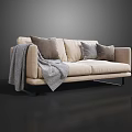 Modern Beige Two Seater Sofa With Gray Pillows And Blanket On Black Legs