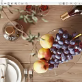Elegant Ceramic Ware Display on Wooden Table with Fresh Fruits Wine Glasses and Olive Branch