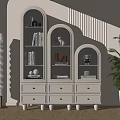 Three Connected Arched Top Bookcase With Drawers Books Decor Items Floor Lamp And Green Plant