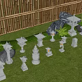 Various Stone Lanterns Arranged On Grass With Bamboo Fence And Rocks