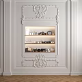 Ornate White Carved Decorative Cabinet In Interior Wall With Displayed Items