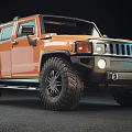 Orange Hummer SUV With Rugged Exterior Design And Large Off Road Tires