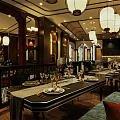 Classic Restaurant Interior With Wooden Decor Hanging Lanterns And Dining Tables