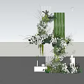 Elegant Floral Installation with White Flowers Green Foliage and Decorative Columns