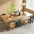 Wooden Kids Study Desk with Various Colored Chairs Stationery Green Tree Decor and Floor Lamp
