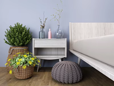 Stylish Bedside Table In Modern Bedroom Interior With Decorative Plants Vases Wicker Basket And Stool 3d model