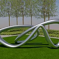 Silver Metallic Landscape Sculpture With Twisted Loop On Green Lawn And Trees Under Blue Sky