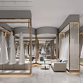 Elegant Bridal Shop Interior With Bridal Gowns Mannequins Chandelier And Display Racks