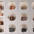 Stylish Handbags Display in Wall Mounted Circular Nooks With Various Colors Patterns and Classic Designs