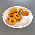 Orange Fried Rings Served on White Marble Plate with Dipping Sauce
