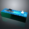Decorative Water Feature With Green Base Blue Water Surface Black Object And White Flame Element