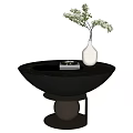 Bowl Shaped Black Coffee Table with Golden Sphere Base and White Vase Holding Flowers