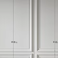 Sleek Modern Wardrobe Interior Design With White Paneled Doors And Metal Handles