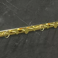 Golden Wall Mounted Bathroom Cabinet Rack With Hooks On Marble Wall