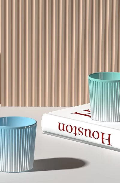 Light Blue And Teal Ribbed Mugs With Wooden Handles On Open Book 3d model