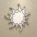 Decorative Mirror on Beige Wall with Irregular Sunburst Shaped Frame Reflecting Bedroom With Furniture