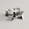 Modern Round Marble Table and Chair Set With Curved Gray White and Potted Green Plant