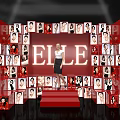 ELLE Themed Photo Check in Spot with Red Background Surrounding Portrait Photos and Red Stage