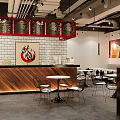 Stylish Modern Restaurant Interior With Red Frames White Brick Wall And Wooden Counter