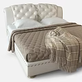 Double Bed with White Tufted Headboard Brown Quilted Comforter and Plaid Fringe Blanket
