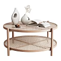 Round Woven Coffee Table With Two Tier Wooden Legs White Vases Coffee Cup Open Book