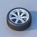 Car Tire With Silver Alloy Rim And Stylish Tread Pattern Design