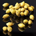 Fresh Ripe Lemons on Plate and Scattered on Black Surface with Reflections