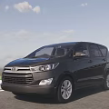 Black Toyota MPV Exterior Design On Scenic Road With Clear Sky