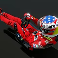 Man In Red Racing Suit With Marlboro Helmet Sitting On Racing Seat