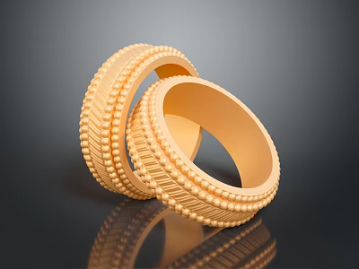 Two Stylish Gold Fashion Rings With Intricate Textured Patterns On Black Surface 3d model
