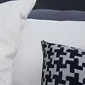 Modern Leather Double Bed With Gray Checkered Quilt And White Gray Pillows