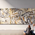 Modern Abstract Painting Featuring Golden Black White Swirls On Wall Two People Viewing